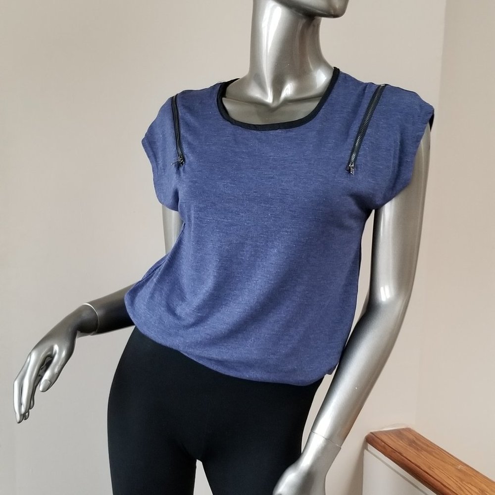Blue top with zippers on shoulder